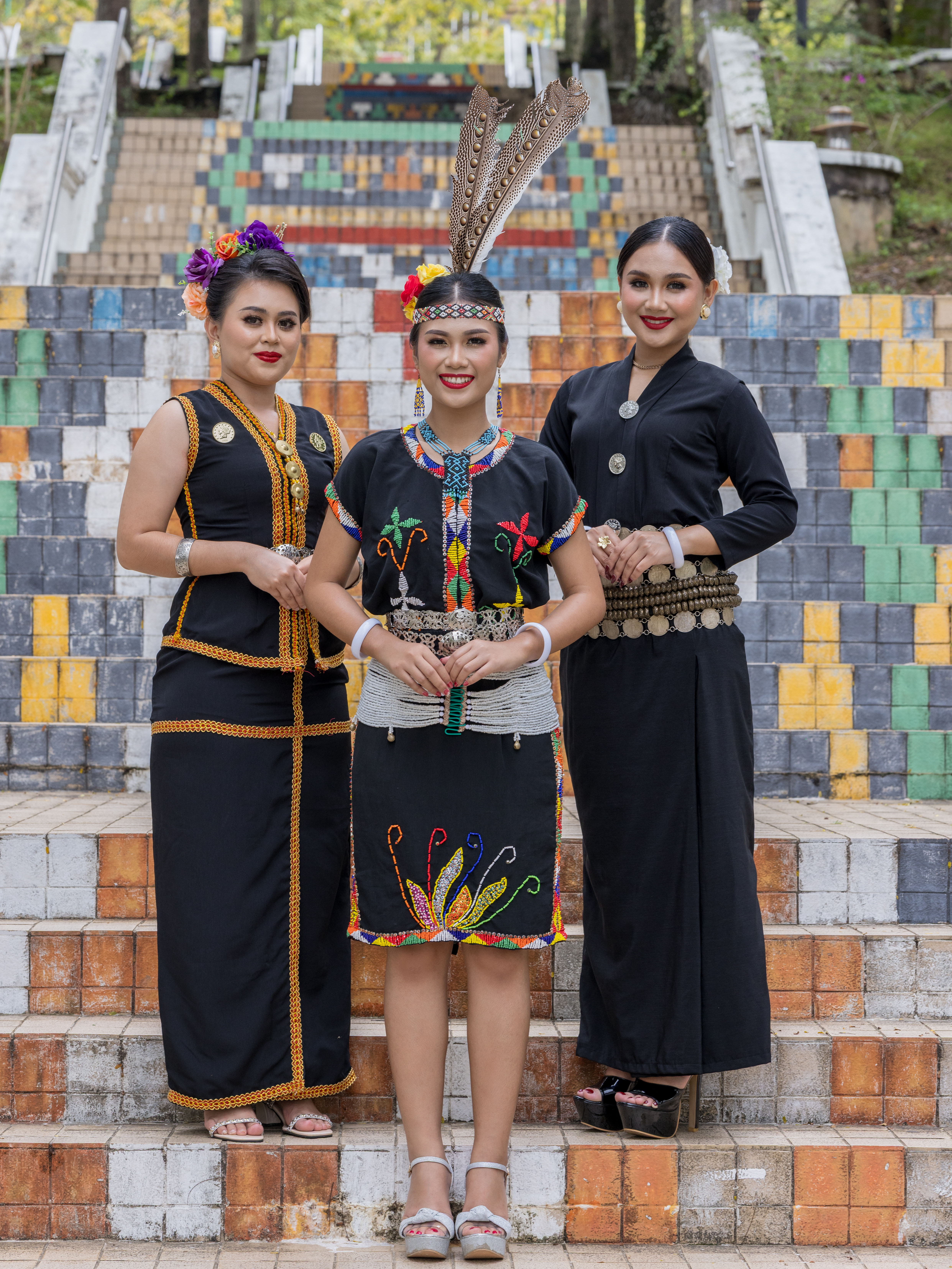 Young men and women wearing traditional indigenous costumes of Sabah and Sarawak ethnic groups during Kaamatan Harvest Festival celebration in Sabah, Borneo, Malaysia.